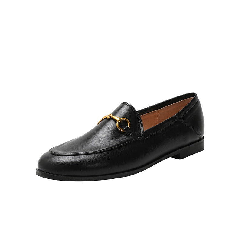 Women with horseshoe buckles and loafers wearing flat bottomed small leather shoes